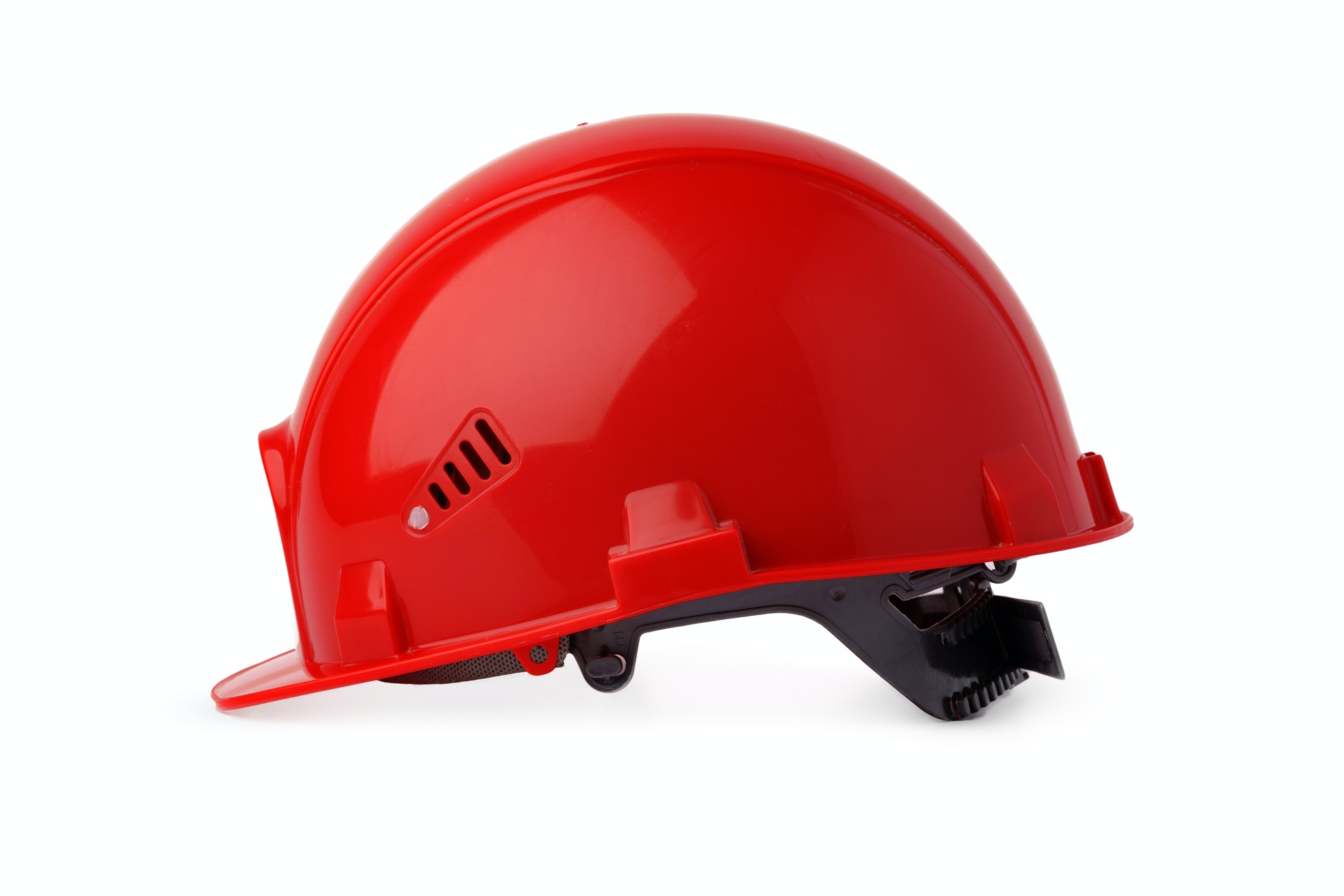 Red plastic safety hardhat isolated on white background